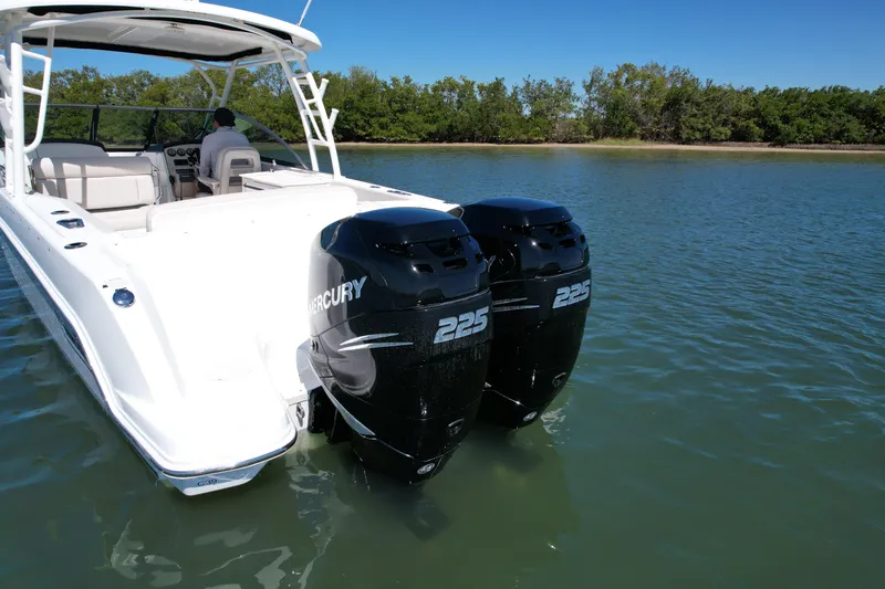 Slide: The Image of 2017 Boston Whaler 270 Vantage with twin Mercury 225 engines on calm water. - 4
