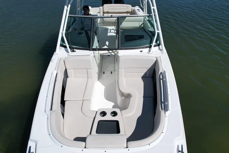 Slide: The Image of 2017 Boston Whaler 270 Vantage boat with spacious seating on calm water. - 5