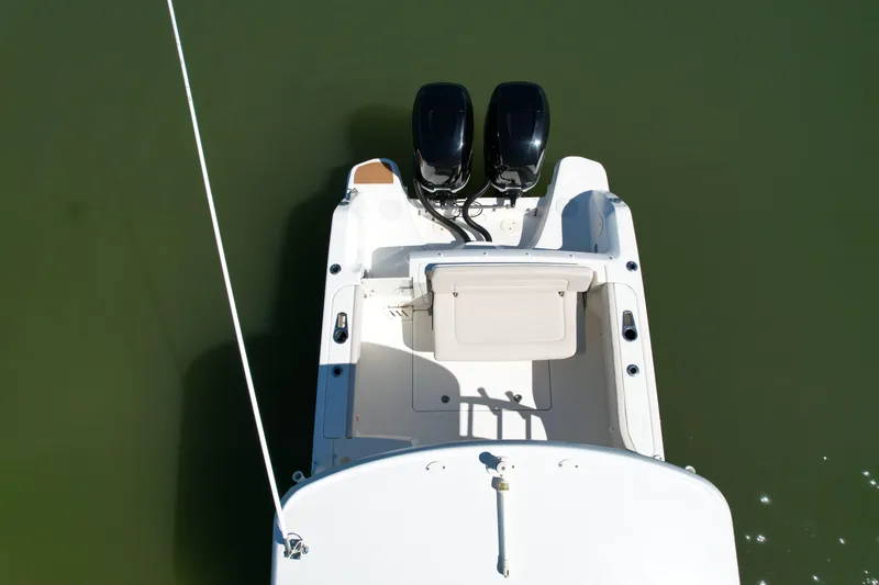 Slide: The Image of 2017 Boston Whaler 270 Vantage boat with dual engines on calm water. - 6