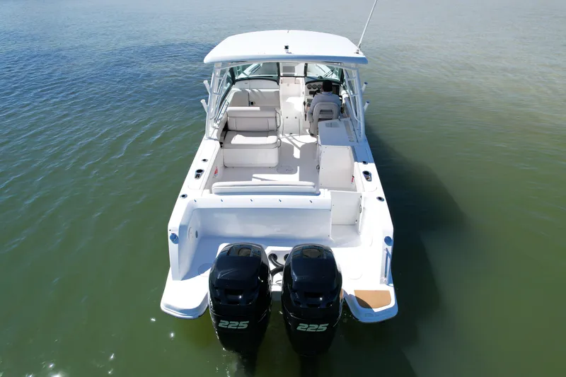 Slide: The Image of 2017 Boston Whaler 270 Vantage boat with dual 225 engines on calm water. - 7