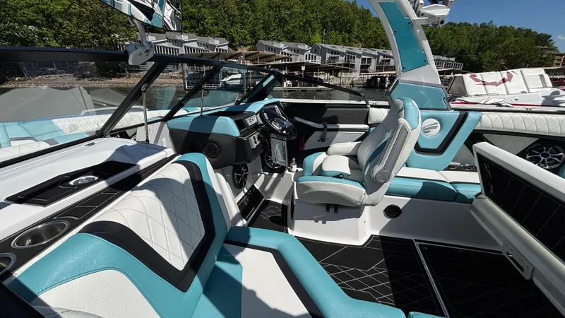 Slide: The Image of 2019 Tigé 25 ZXS boat interior with modern seating and sleek design. - 18