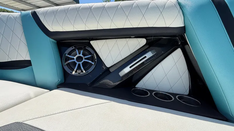 Slide: The Image of 2019 Tigé 25 ZXS boat interior with speaker and cup holders. - 21