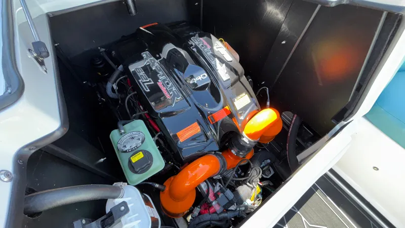 Slide: The Image of Engine compartment of 2019 Tigé 25 ZXS boat with visible components. - 24