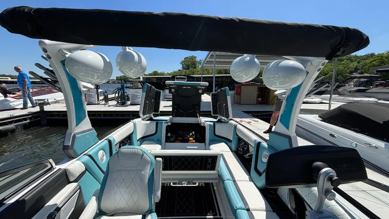 Slide: The Image of 2019 Tigé 25 ZXS boat interior with modern seating and sleek design. - 33
