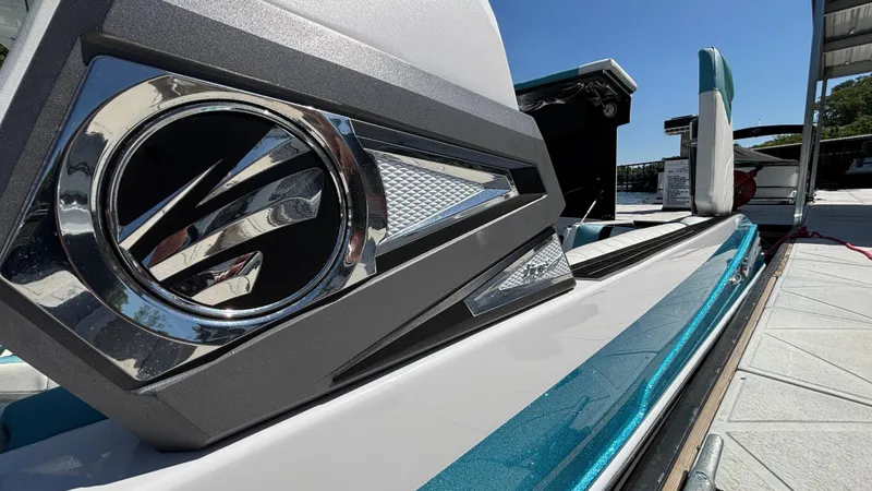 Slide: The Image of 2019 Tigé 25 ZXS boat with sleek design and modern detailing at a dock. - 34