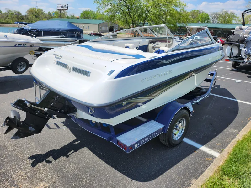 Slide: The Image of 2008 Crownline 180 BR boat on trailer in parking lot, sunny day. - 1