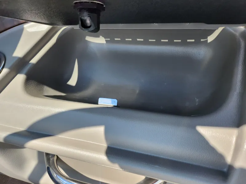 Slide: The Image of Glove compartment of 2008 Crownline 180 BR boat, open and empty. - 15
