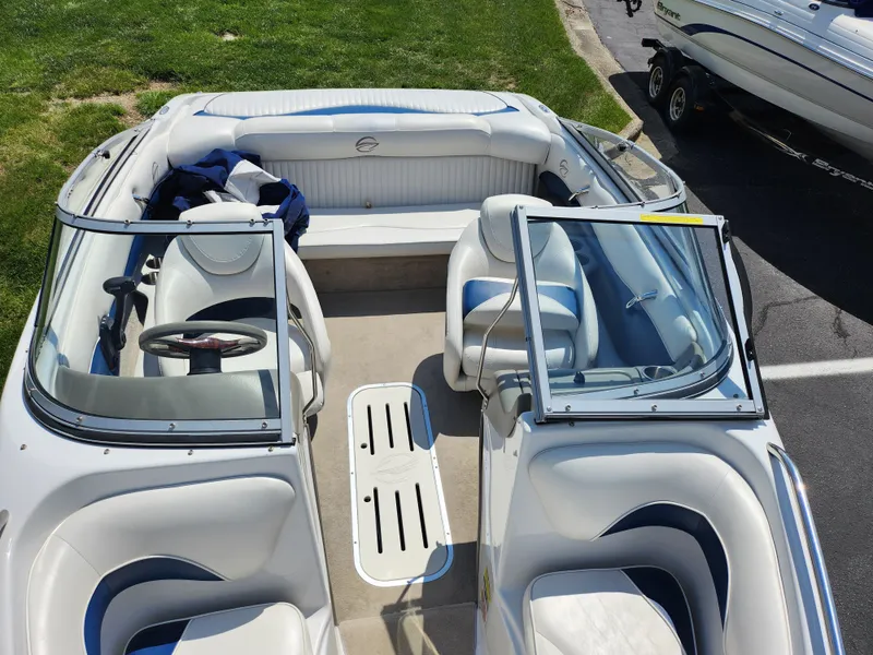 Slide: The Image of 2008 Crownline 180 BR boat interior with white seating and open windshield. - 21