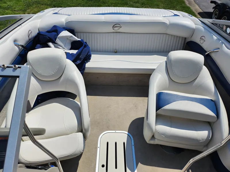 Slide: The Image of 2008 Crownline 180 BR boat interior with white and blue seating. - 22