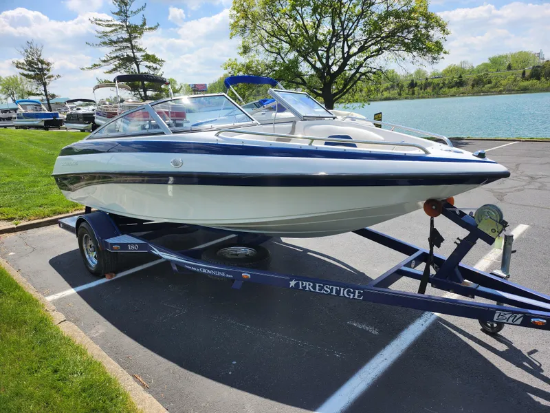 Slide: The Image of 2008 Crownline 180 BR boat on trailer by lakeside, sunny day. - 8
