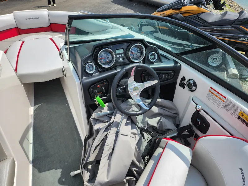 Slide: The Image of 2013 Moomba Mojo 2.5 boat interior with steering wheel and dashboard. - 14