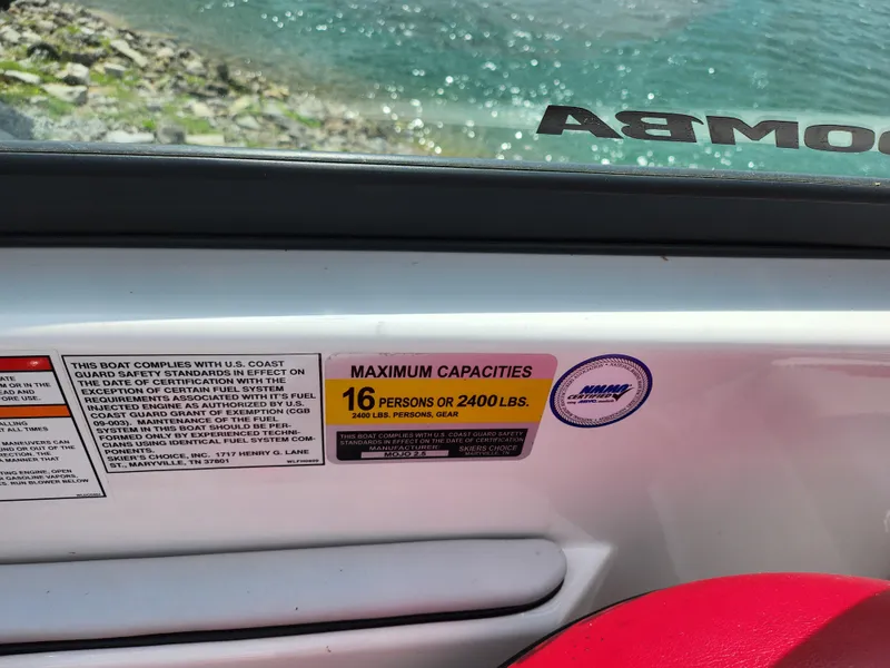 Slide: The Image of 2013 Moomba Mojo 2.5 boat capacity label, 16 persons or 2400 lbs, near water. - 15