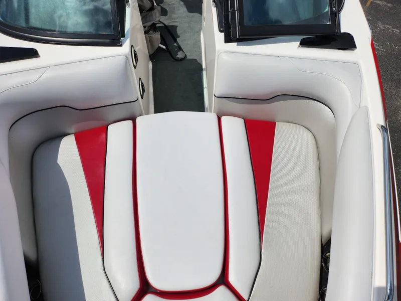 Slide: The Image of 2013 Moomba Mojo 2.5 boat interior with white and red seating. - 22