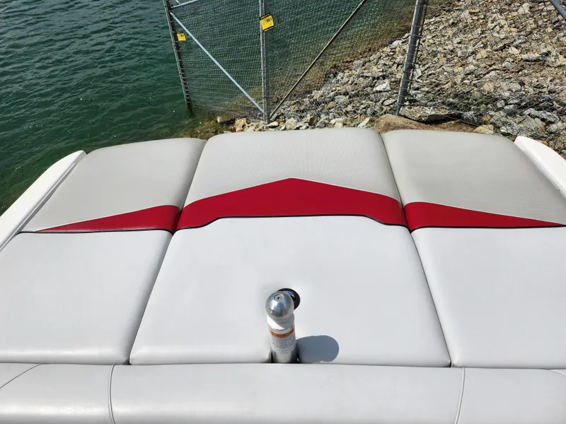Slide: The Image of Rear seating of 2013 Moomba Mojo 2.5 boat with red and white upholstery. - 26