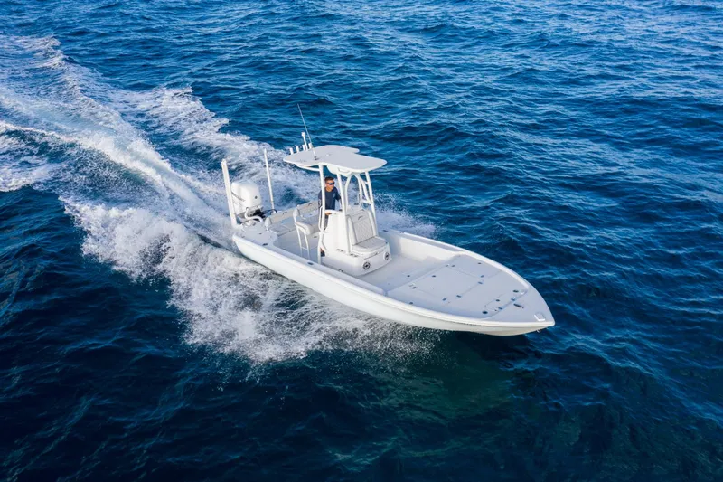 Slide: The Image of 2025 Yellowfin 24 Bay CE boat cruising on open water. - 3