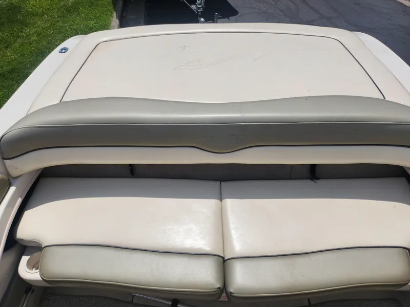 Slide: The Image of 2004 Sea Ray 200 Sport boat with beige leather seating and sun deck. - 21