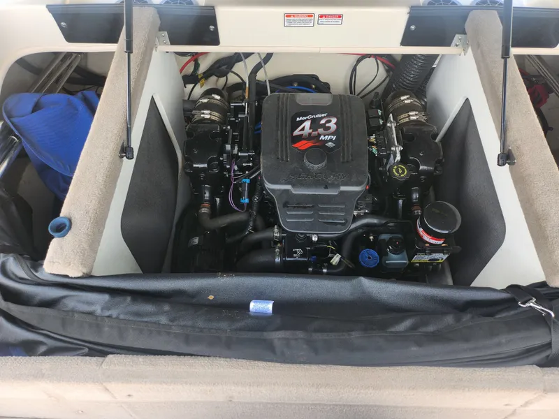 Slide: The Image of Engine compartment of a 2004 Sea Ray 200 Sport boat, featuring a 4.3 MPI engine. - 22
