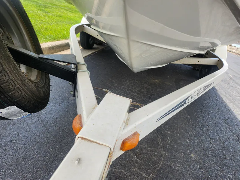 Slide: The Image of Trailer for 2004 Sea Ray 200 Sport boat on pavement. - 6