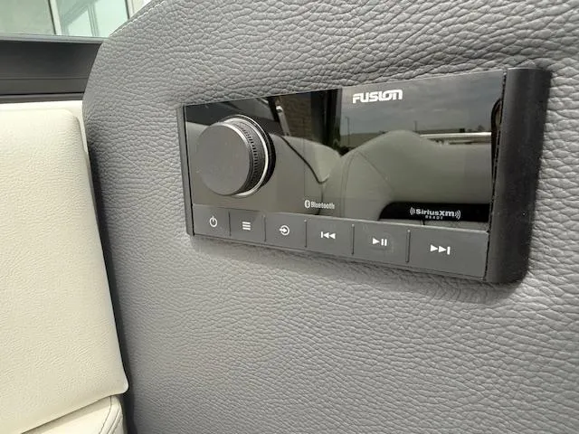 Slide: The Image of Control panel in 2023 Regal LS6 boat with Bluetooth and SiriusXM features. - 14