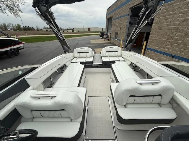 Slide: The Image of 2023 Regal LS6 boat interior with white seating and modern design. - 24