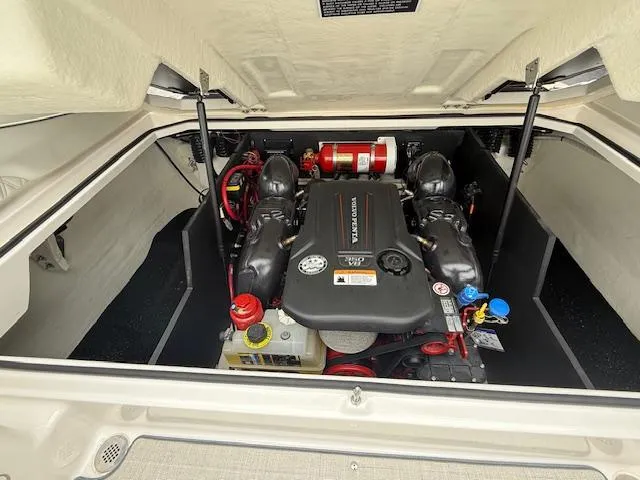Slide: The Image of 2023 Regal LS6 engine compartment with visible components and fire extinguisher. - 33
