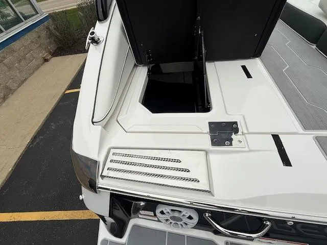 Slide: The Image of 2023 Regal LS6 boat with open storage compartment on deck. - 36