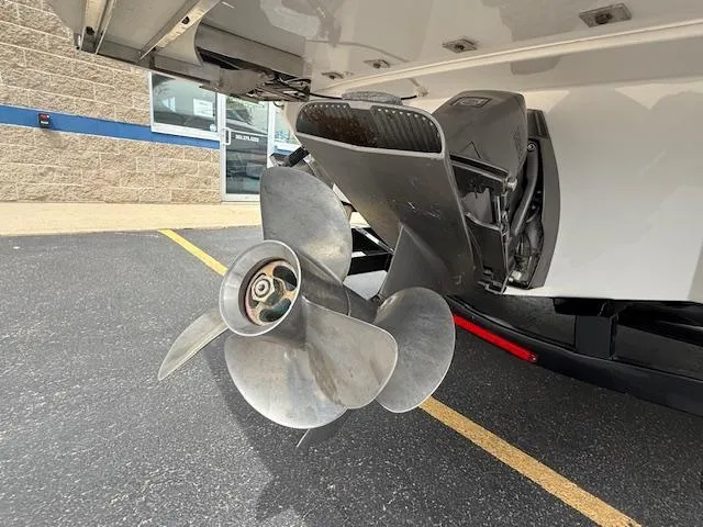 Slide: The Image of 2023 Regal LS6 boat propeller and stern drive in a parking lot. - 43