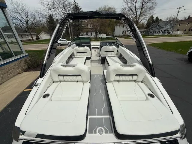 Slide: The Image of 2023 Regal LS6 boat with sleek white interior and modern design. - 5