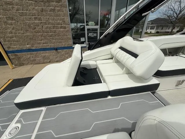 Slide: The Image of 2023 Regal LS6 boat with white leather seating and modern design. - 6