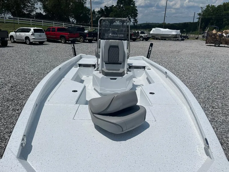 Slide: The Image of 2025 Xpress H22 Bay boat with sleek white deck and modern seating. - 4
