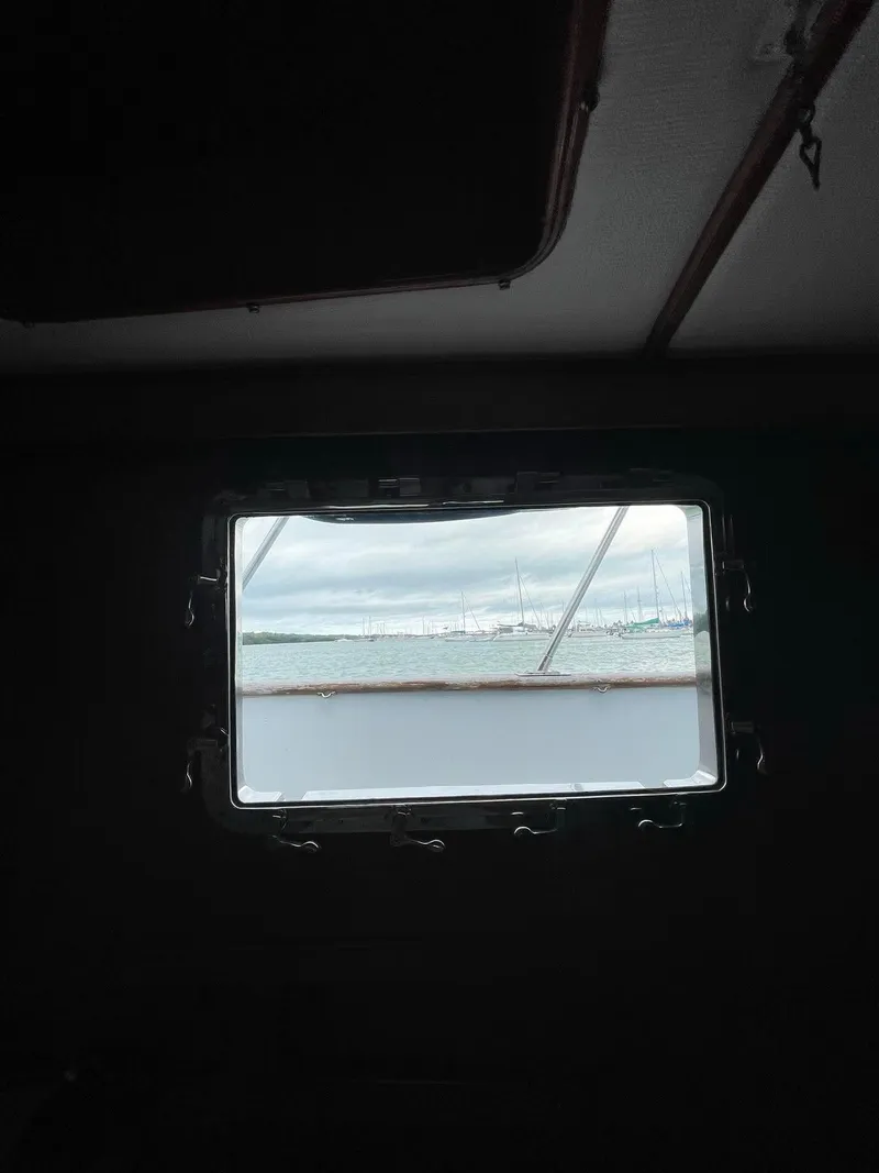 Slide: The Image of 1981 Albin 45 Command Bridge window view with overcast sky. - 24
