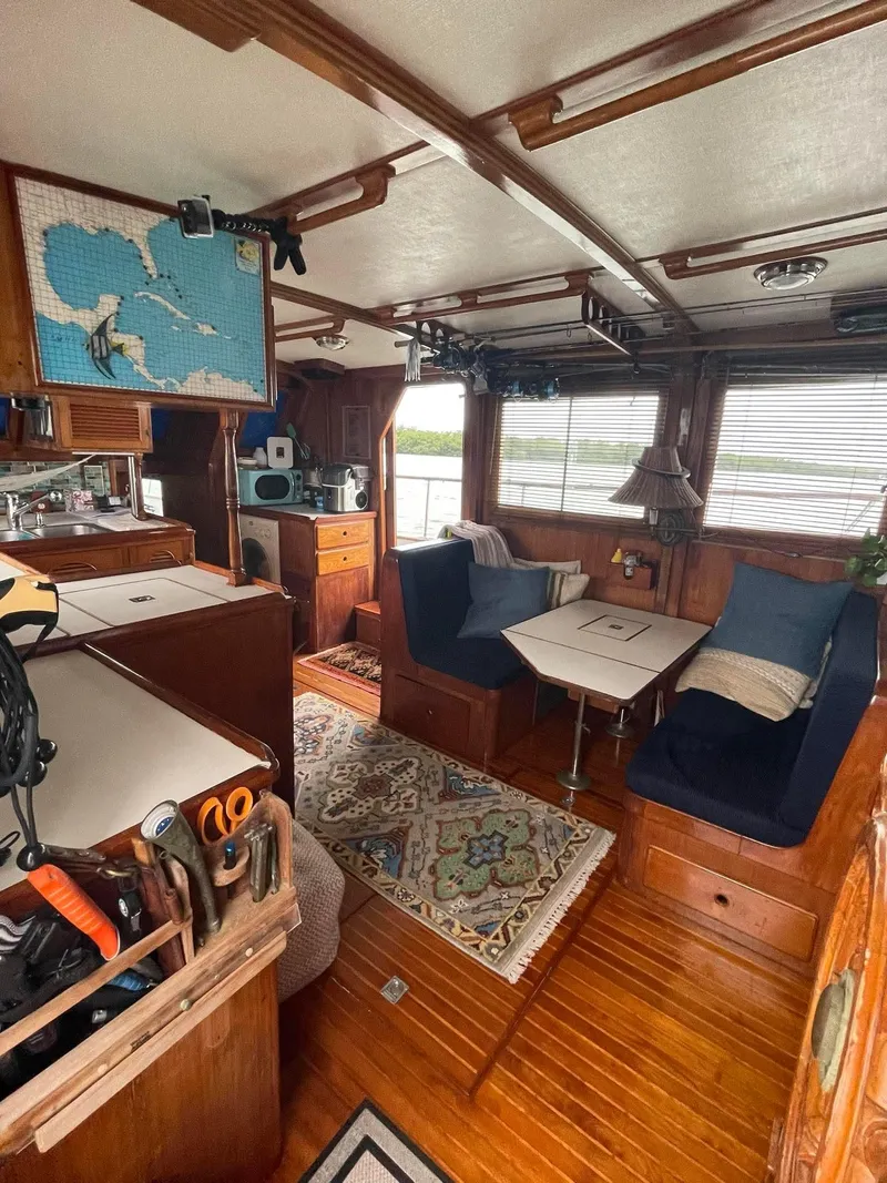 Slide: The Image of Interior of 1981 Albin 45 Command Bridge with cozy seating and nautical decor. - 31