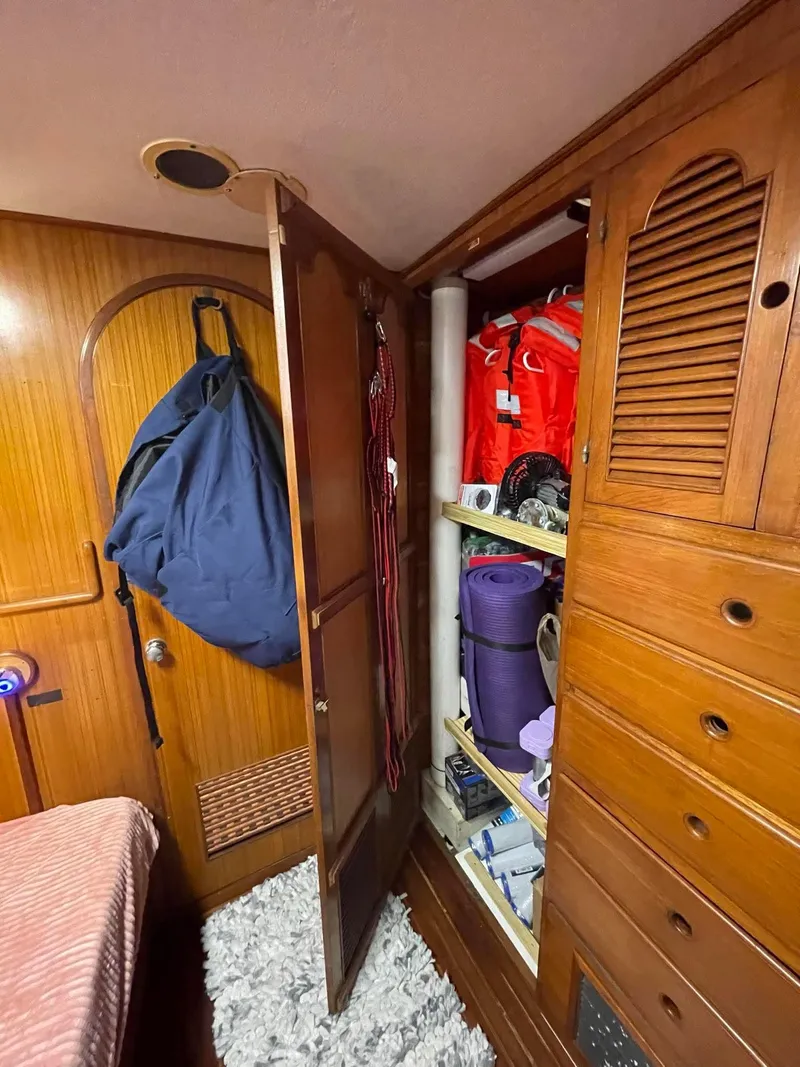 Slide: The Image of Interior of 1981 Albin 45 Command Bridge with wooden cabinets and storage space. - 44