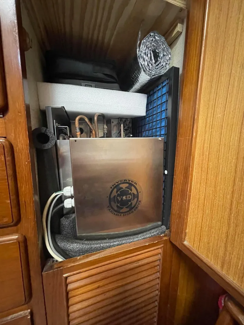 Slide: The Image of Interior view of 1981 Albin 45 Command Bridge showing equipment storage with VSD unit. - 45