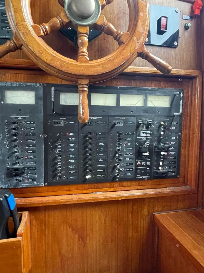 Slide: The Image of 1981 Albin 45 Command Bridge control panel with wooden steering wheel. - 8