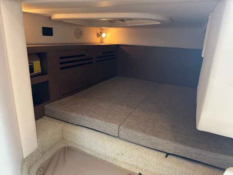 Slide: The Image of Interior cabin of 2015 Sea Ray 280 Sundancer with cozy sleeping area. - 45