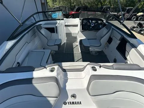 Slide: The Image of 2024 Yamaha Boats SX190 interior with seating and steering console, showcasing modern design. - 6