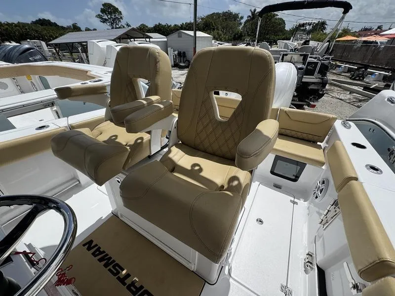 Slide: The Image of 2025 Sportsman Heritage 261 boat with tan seats and modern design. - 12