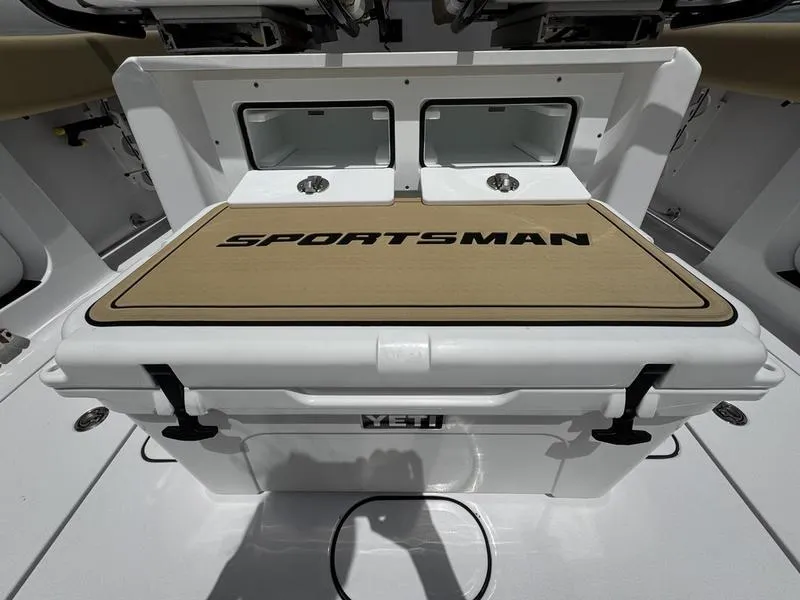 Slide: The Image of 2025 Sportsman Heritage 261 boat deck with Yeti cooler and dual sinks. - 17