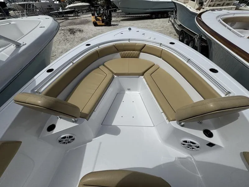 Slide: The Image of 2025 Sportsman Heritage 261 boat with tan seating and spacious deck layout. - 5