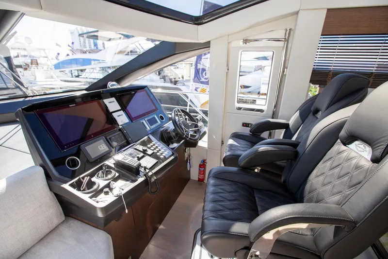 Slide: The Image of Luxurious Sunseeker 74 Predator 2020 yacht cockpit with modern controls and plush seating. - 10