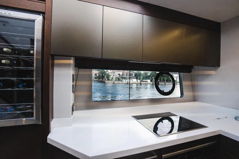 Slide: The Image of Modern kitchen interior of 2020 Sunseeker 74 Predator yacht with sleek design and waterfront view. - 16