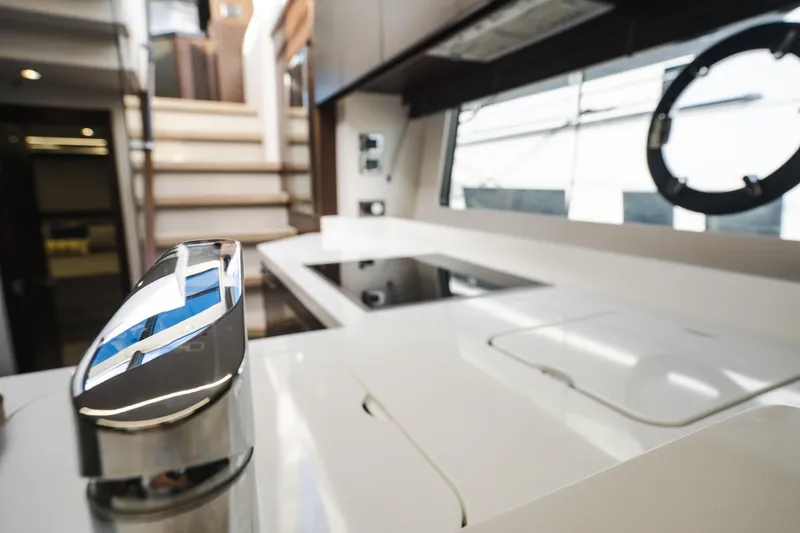 Slide: The Image of Interior of 2020 Sunseeker 74 Predator yacht, featuring sleek modern kitchen design. - 18