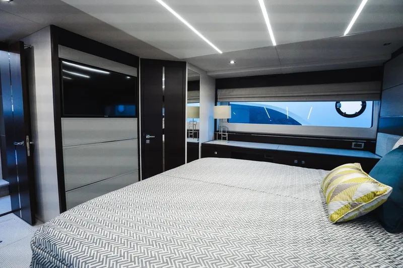 Slide: The Image of Luxurious bedroom interior of 2020 Sunseeker 74 Predator yacht with modern design and large window. - 22