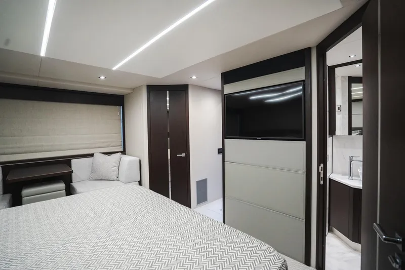 Slide: The Image of Luxurious interior of 2020 Sunseeker 74 Predator yacht bedroom with modern design and amenities. - 25