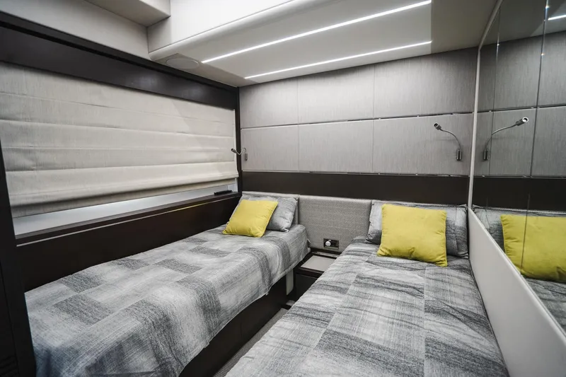 Slide: The Image of Interior of 2020 Sunseeker 74 Predator yacht with twin beds and modern decor. - 27