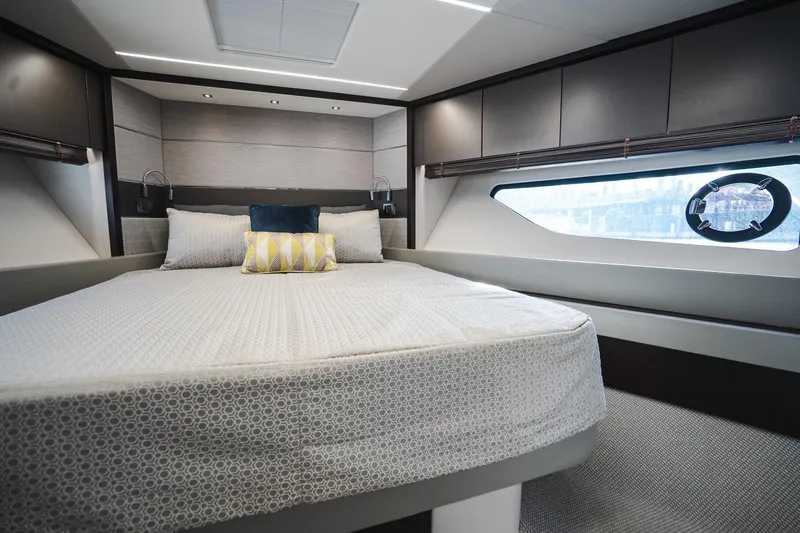 Slide: The Image of Luxurious bedroom interior of 2020 Sunseeker 74 Predator yacht with modern design and large window. - 29