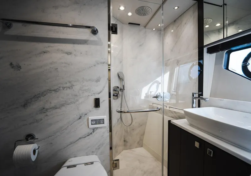 Slide: The Image of Luxurious bathroom in 2020 Sunseeker 74 Predator yacht with marble walls and modern fixtures. - 31