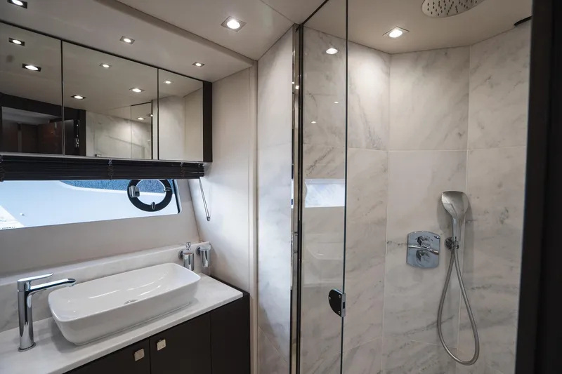 Slide: The Image of Luxurious bathroom in 2020 Sunseeker 74 Predator yacht with modern fixtures and marble accents. - 34