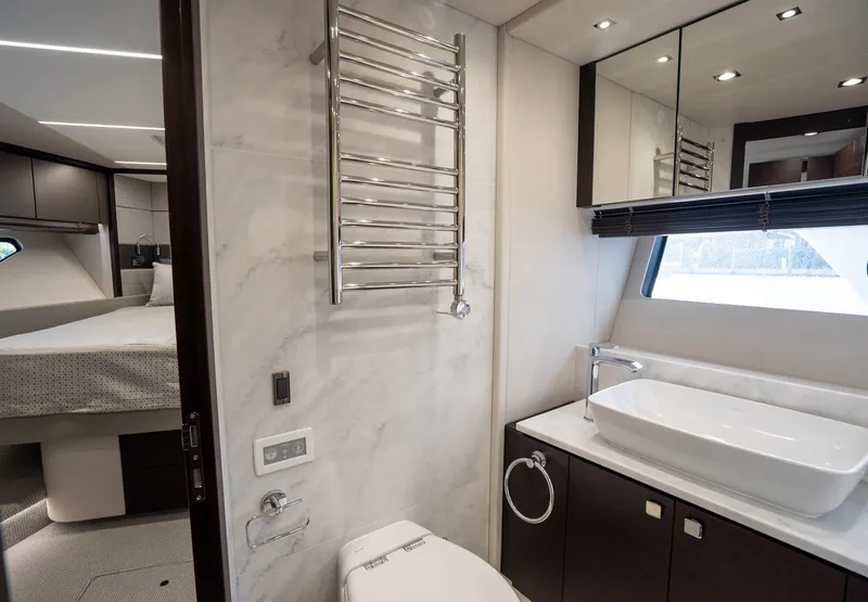 Slide: The Image of Luxurious bathroom interior of 2020 Sunseeker 74 Predator yacht, featuring modern fixtures and elegant design. - 35